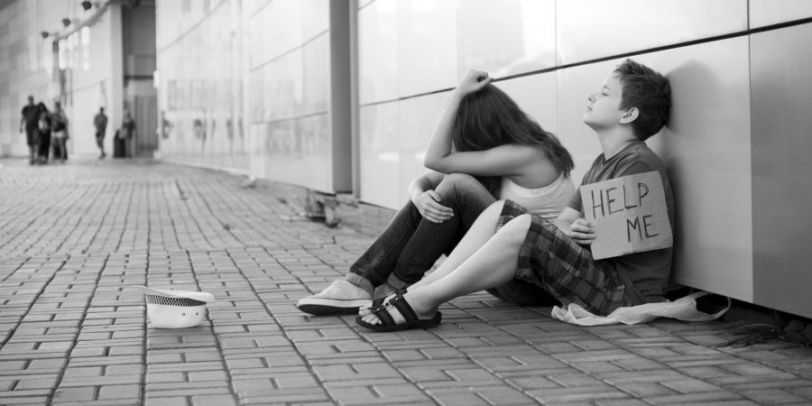 Homeless teenage boy and girl